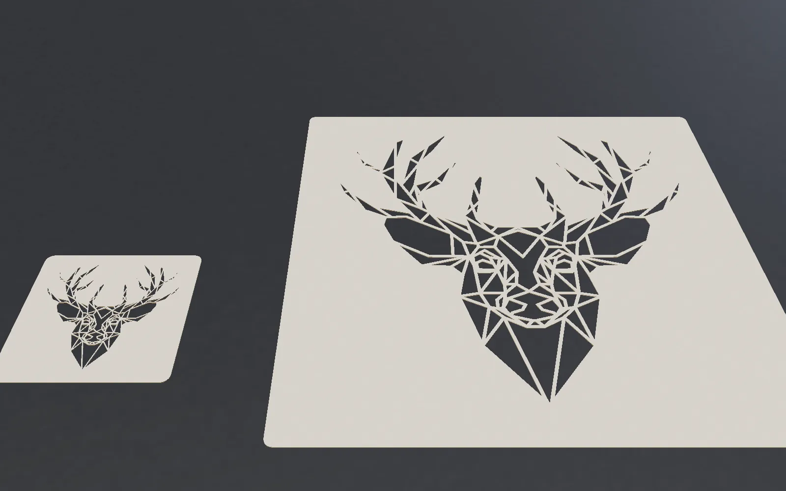 The same deer stencil in card at 100 mm and at 300 mm: at the small size the bridges and gaps become very thin