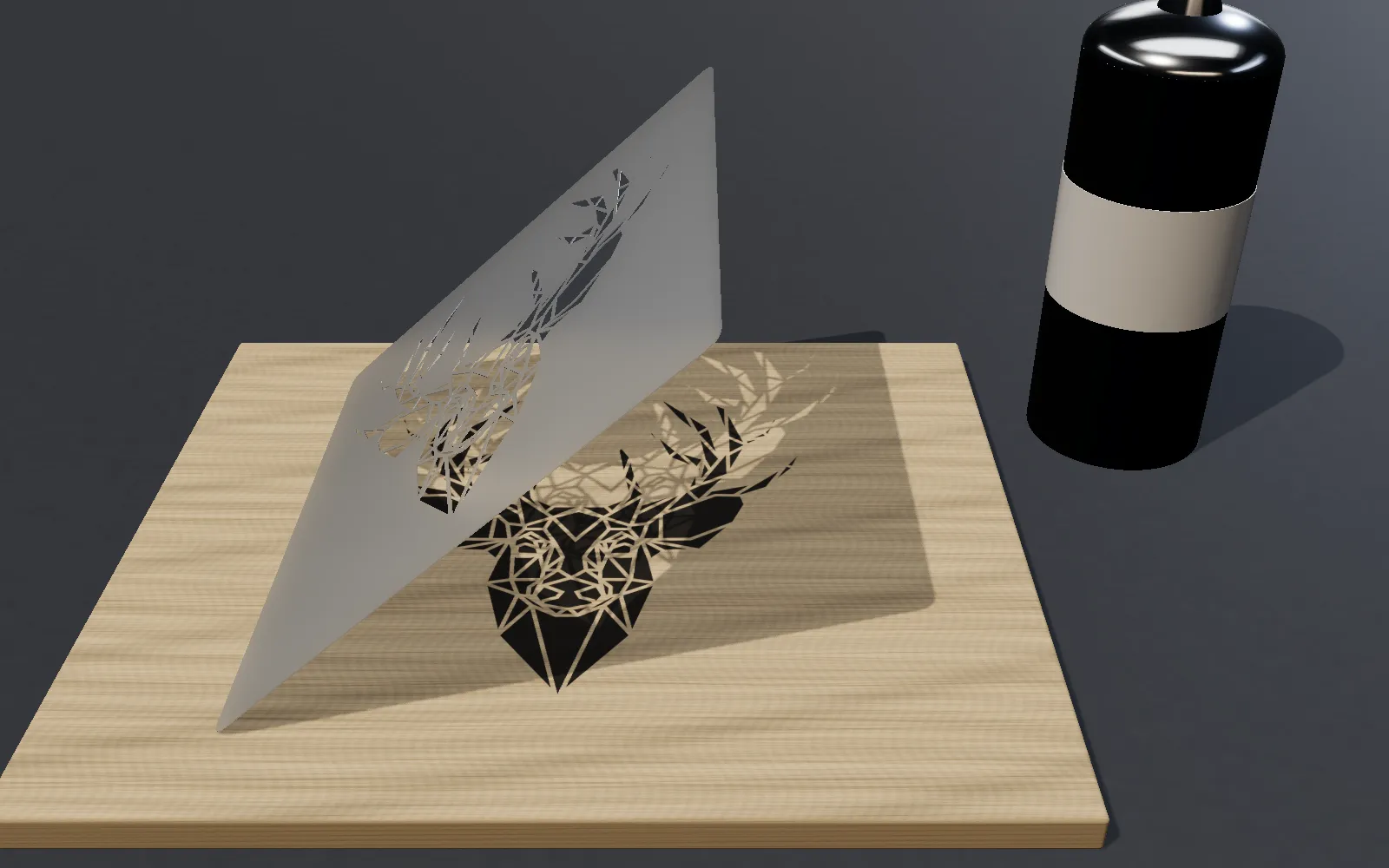 A PET stencil of a geometric deer lifted off a birch board, revealing the black spray-painted deer, with a spray can beside it