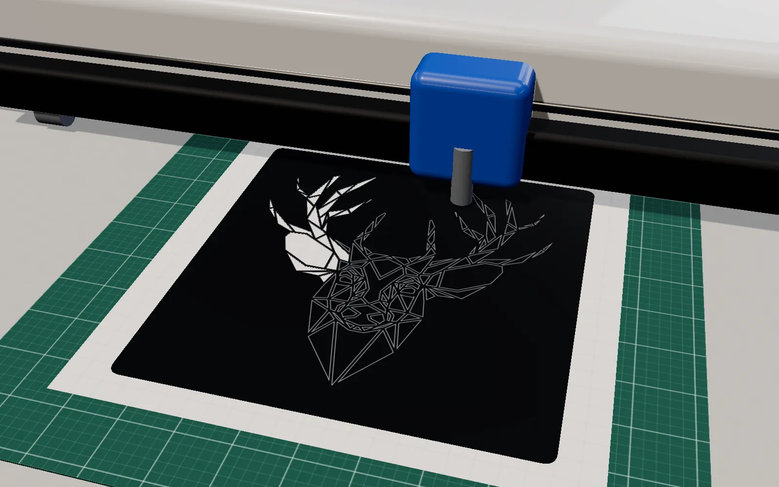 A blade cutter cutting the deer in black adhesive vinyl on a green cutting mat: the left part is already weeded, the rest shows the cut lines