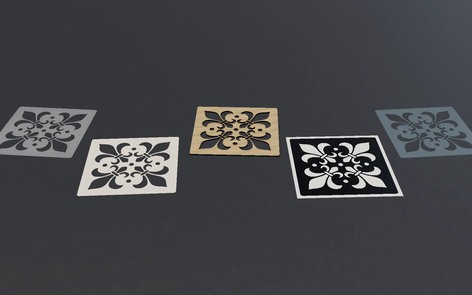 The same fleur-de-lis stencil in five materials side by side: PET (Mylar), card, plywood, black adhesive vinyl on its backing, and PVC film