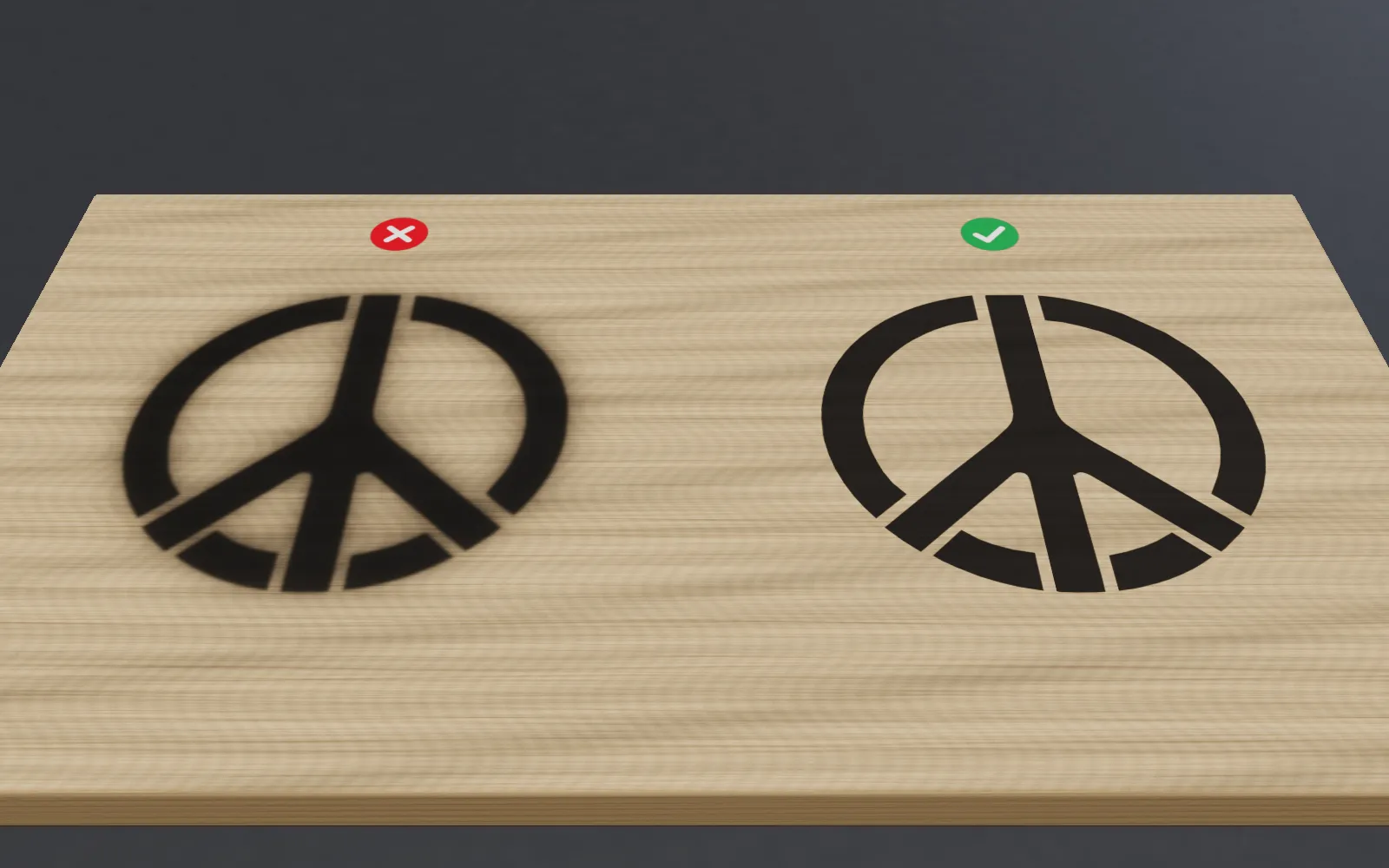 Two spray-painted peace signs on wood: on the left the paint crept under the stencil and blurred the edges; on the right the edges are sharp